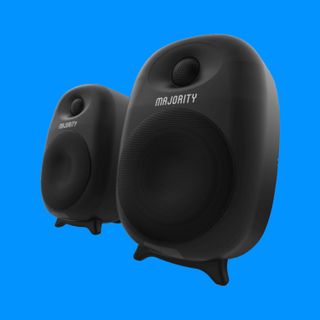 The Majority D80 Active Bluetooth bookshelf speakers on a blue background