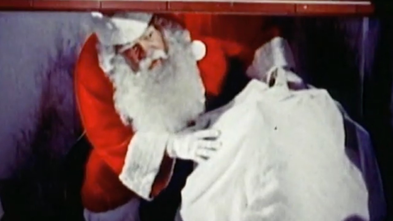 Santa Claus entering via a chimney.