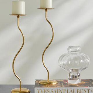 Two curvy gold candleholders