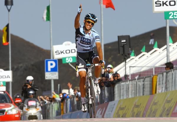 Alberto Contador (Saxo Bank Sungard) fires his pistol to celebrate the stage win.