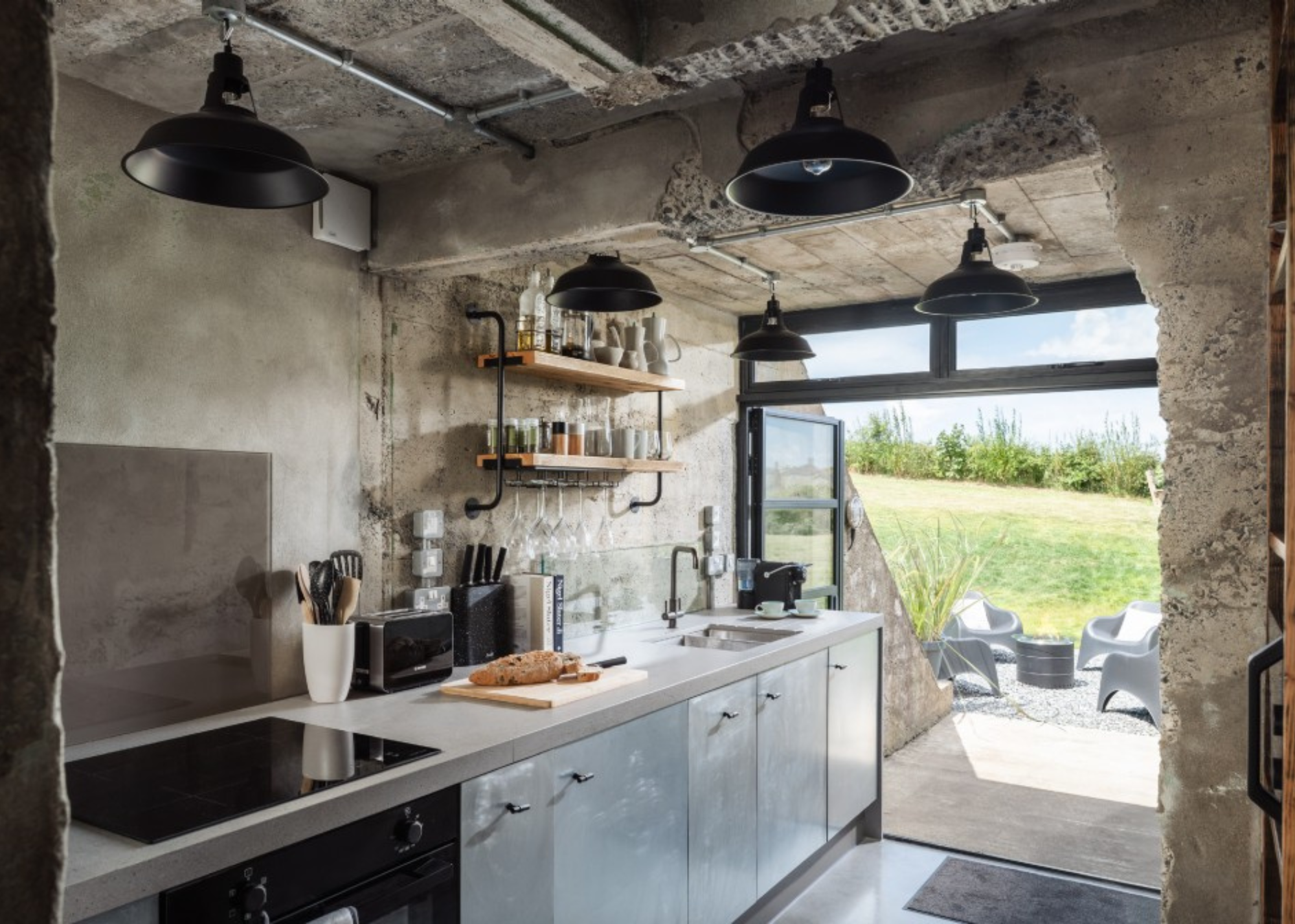 modern industrial kitchen in a concrete bunker