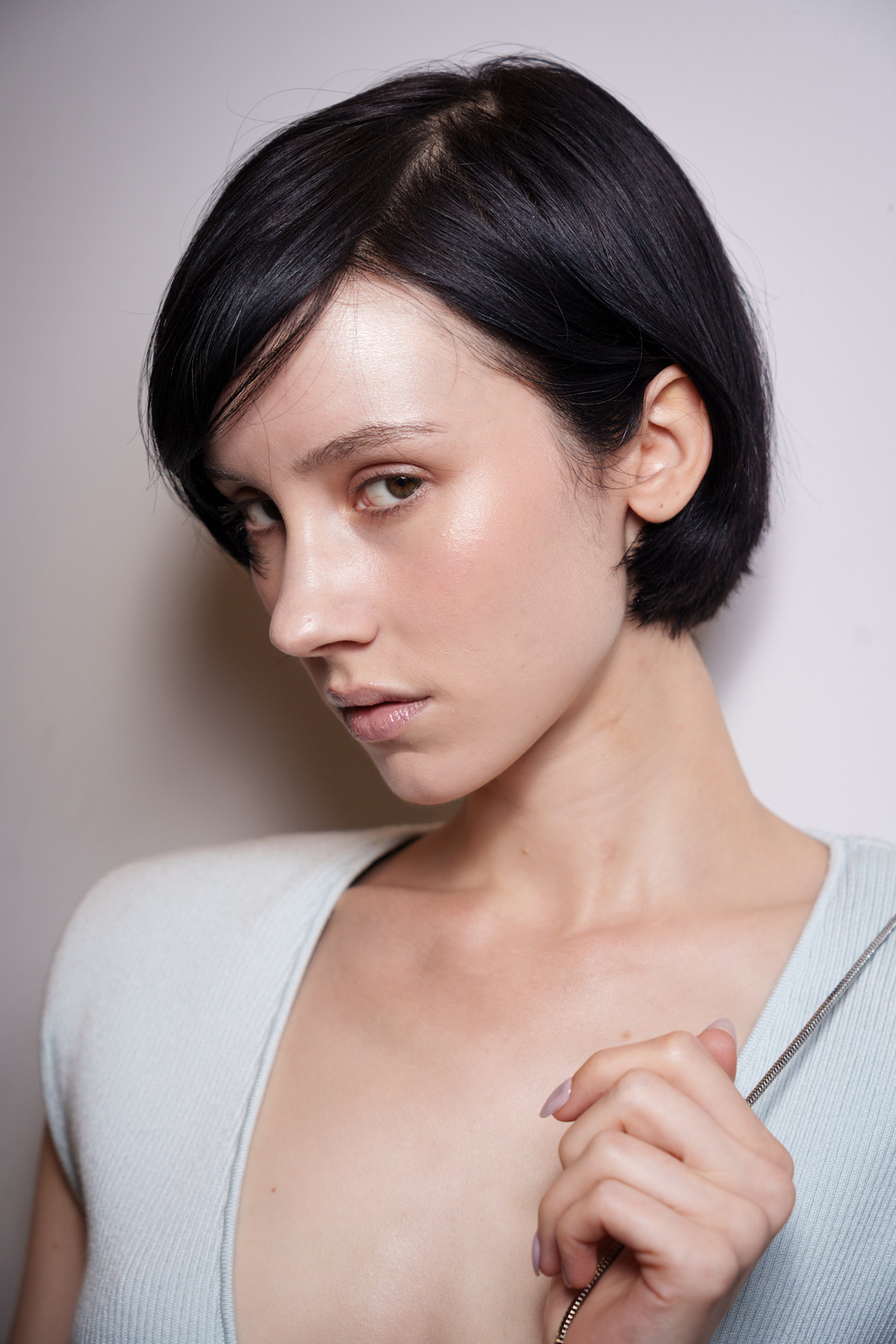 A model showing off a curved retro-looking bixie cut.