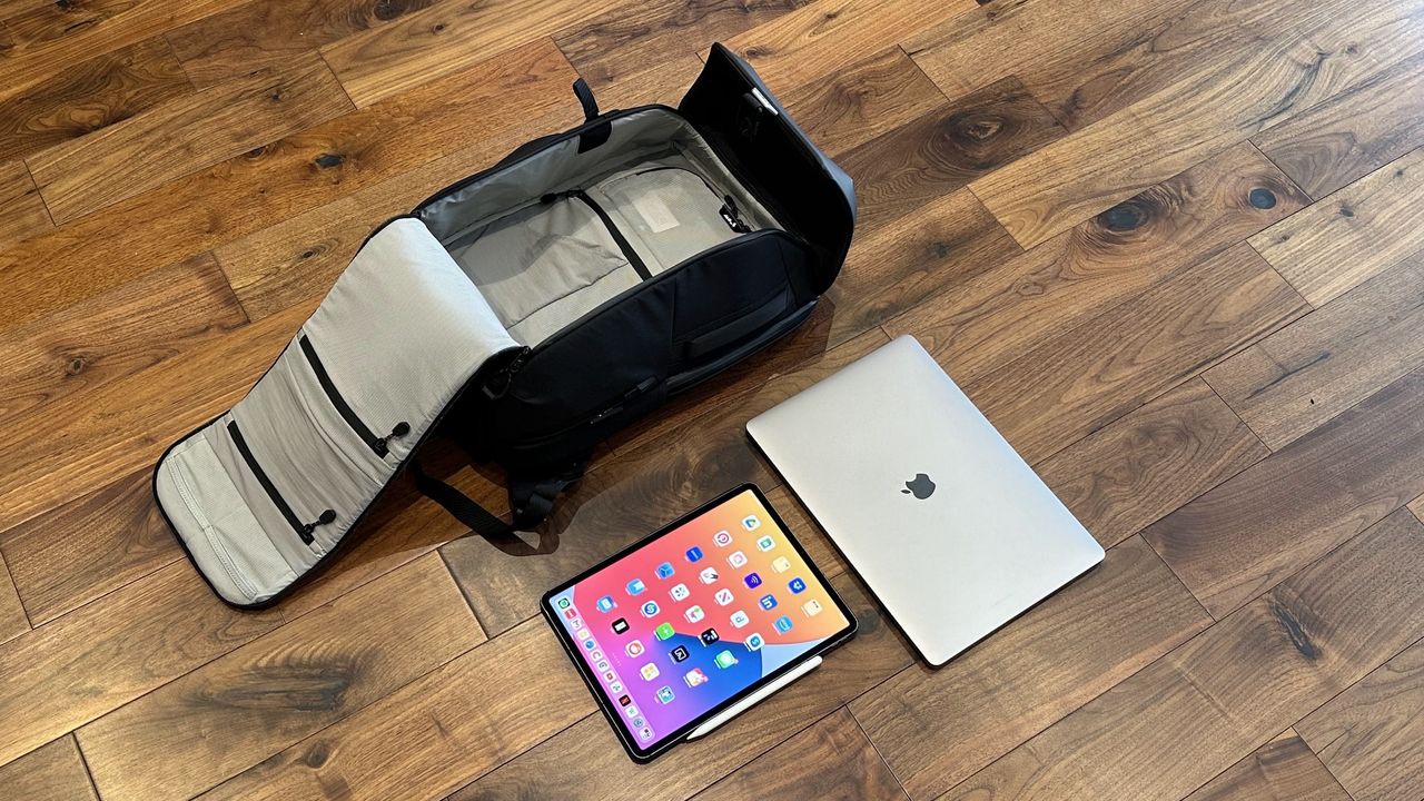 Mous Extreme Commuter backpack on a wooden floor in a living room