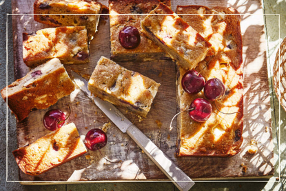 Fruity tray bake cut into slices with cherries