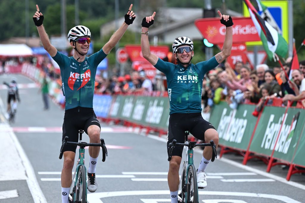 MAESTU PARQUE NATURAL DE IZKI SPAIN SEPTEMBER 05 LR Unai Iribar of Spain and Antonio Jesus Soto of Spain and Team Equipo Kern Pharma celebrate the victory of their teammate crossing the finish line during the La Vuelta 79th Tour of Spain 2024 Stage 18 a 1798km stage from VitoriaGasteiz to Maestu Parque Natural de Izki UCIWT on September 05 2024 in Maestu Parque Natural de Izki Spain Photo by Tim de WaeleGetty Images