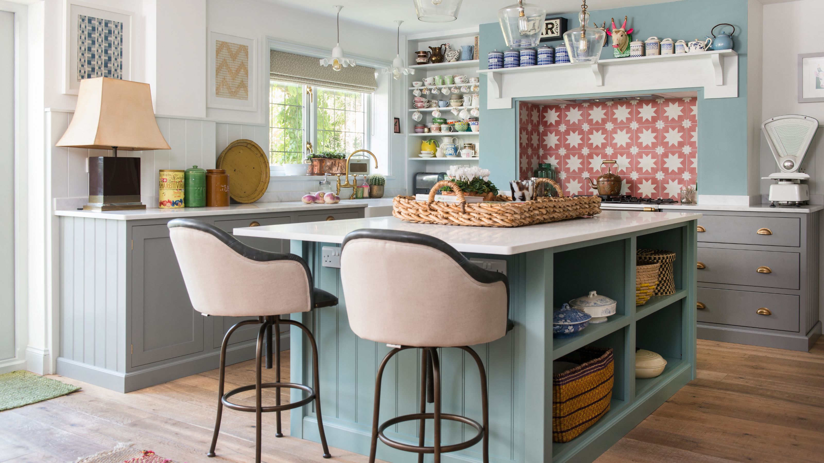 Kitchen with open shelving and island with storage and two bar stools