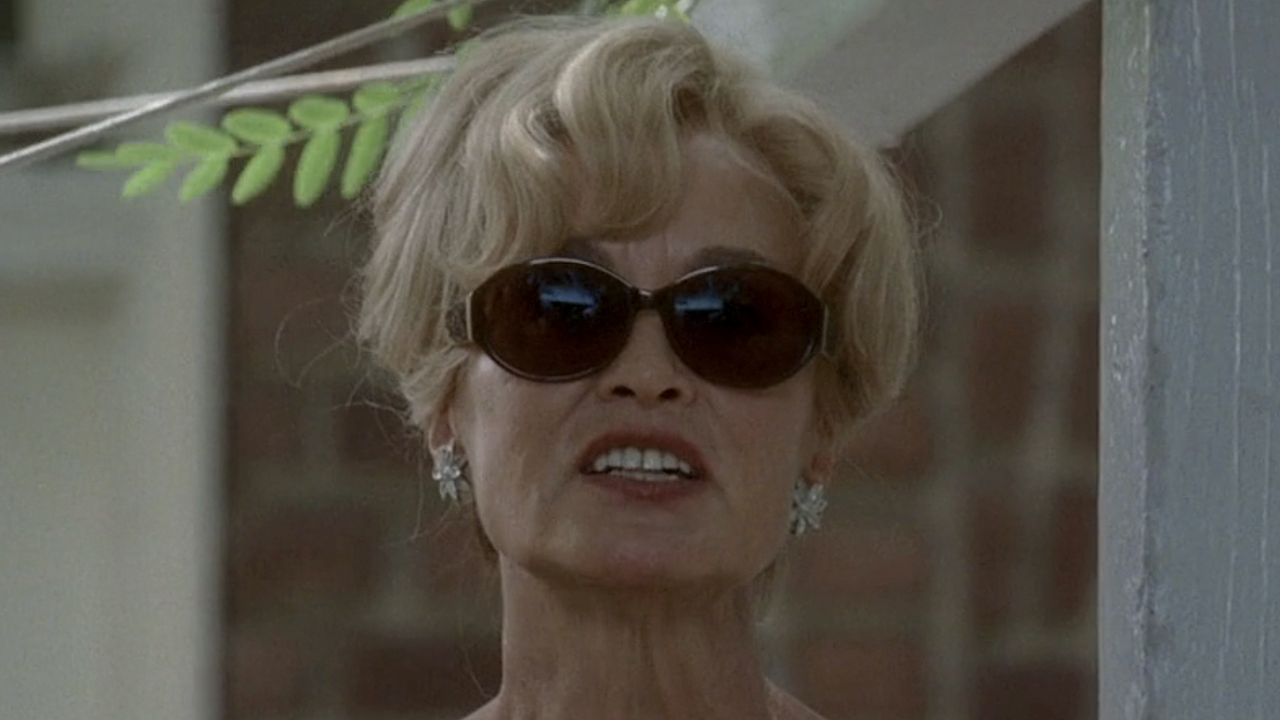 Constance in sunglasses outside talking to Ben in American Horror Story: Murder House