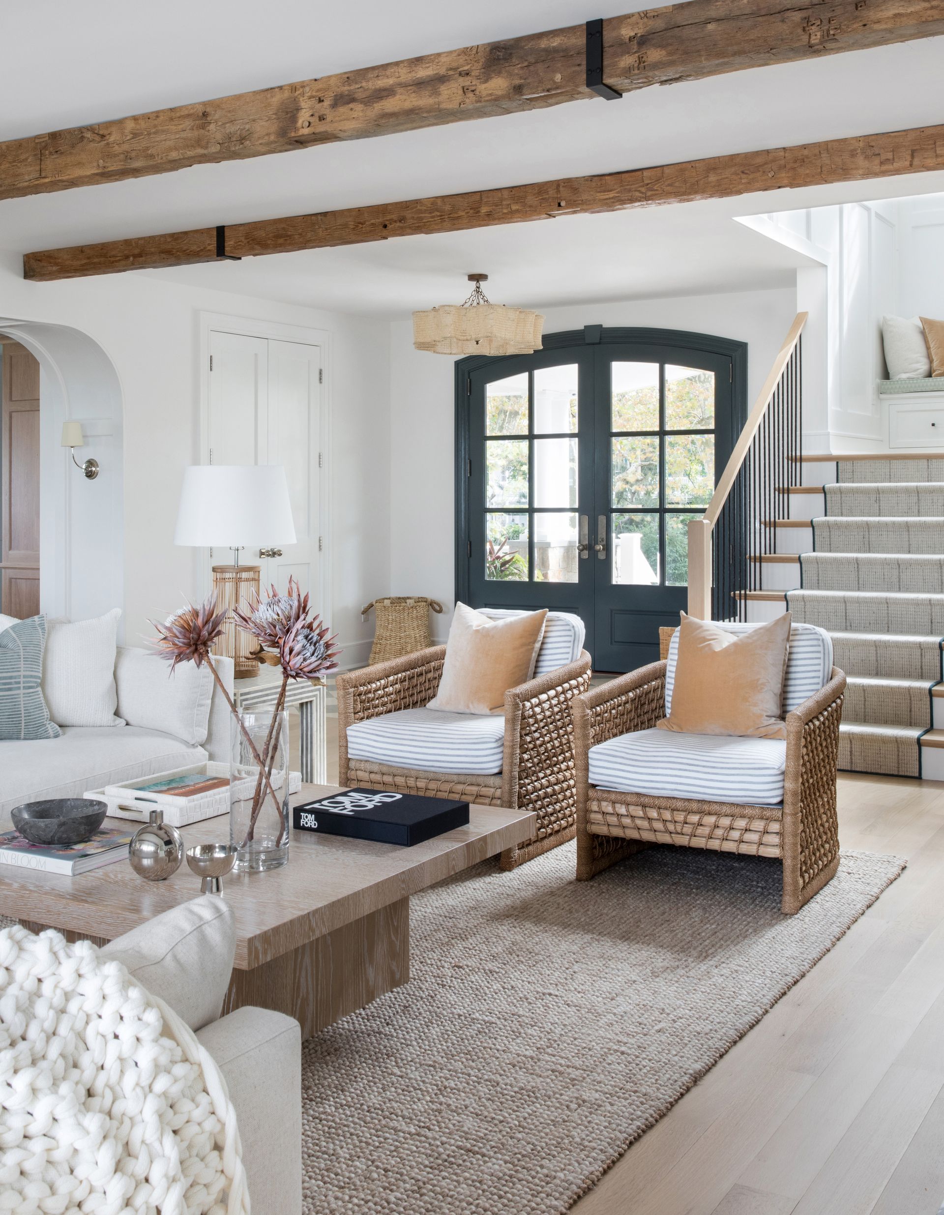 living room in white with two rattan chairs