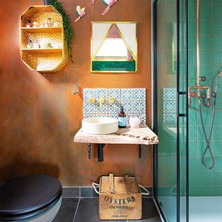 copper bathroom with tiled sink splashback