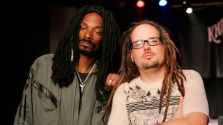 Jonathan Davis and Snoop looking at the camera with serious expressions