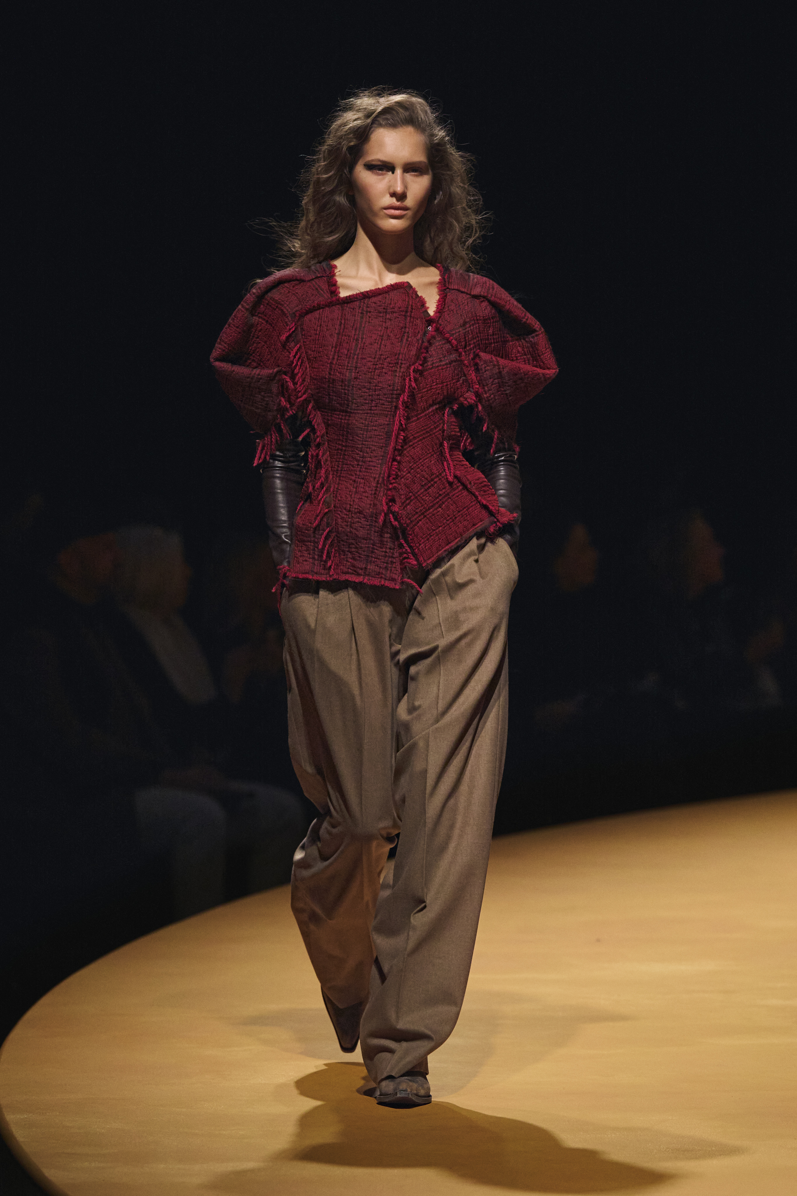 Autumn/Winter 25 trouser trends - extra-wide leg brown trousers red top, Khaite runway