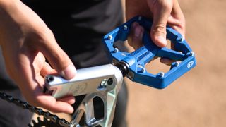 Rider fitting the Crankbrothers Stamp 1 Gen 2 flat MTB pedal
