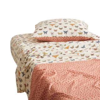 A butterfly print and orange bed sheet set