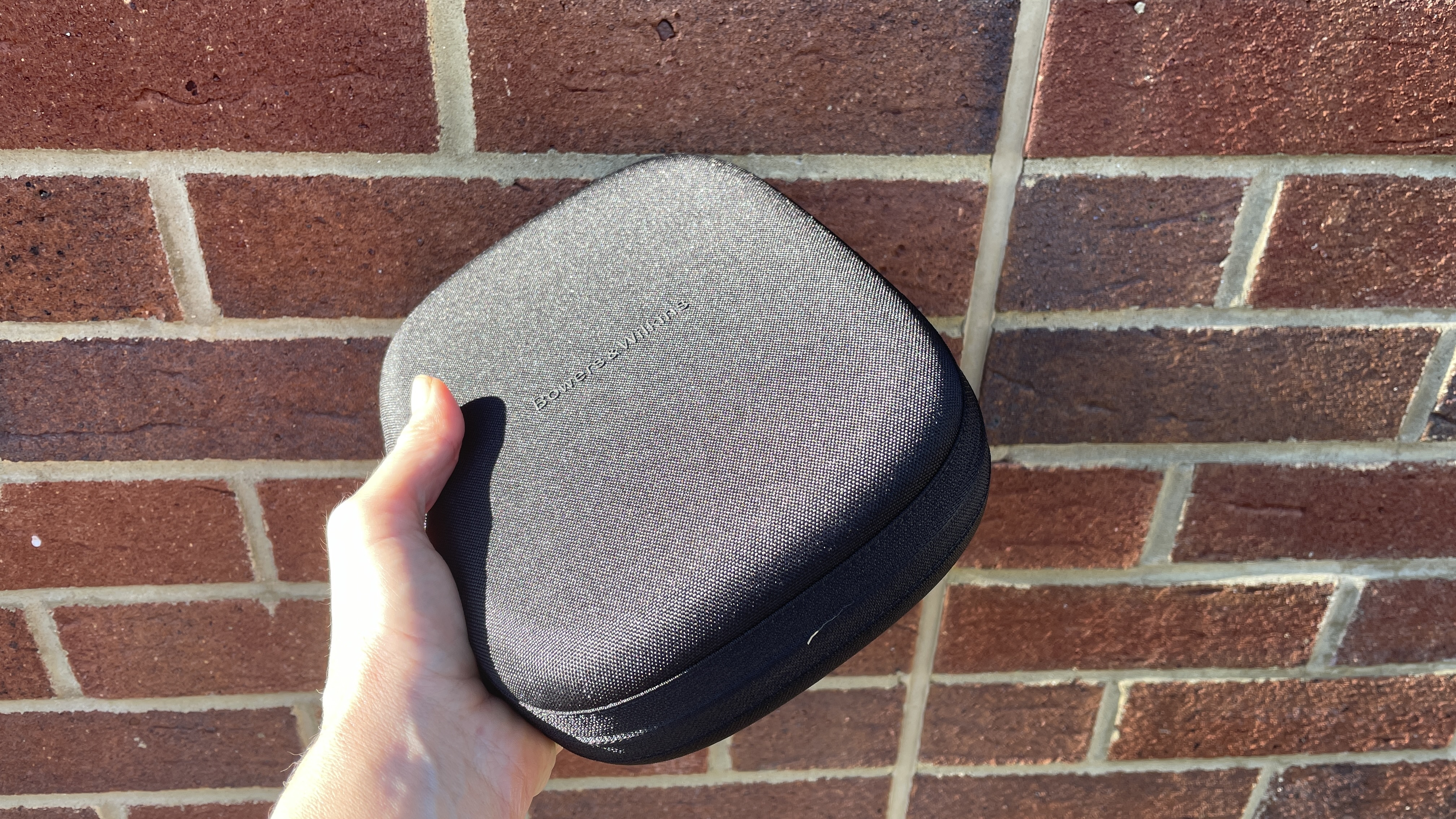 Bowers &amp;amp; Wilkins Px8 S2 in front of a red brick wall