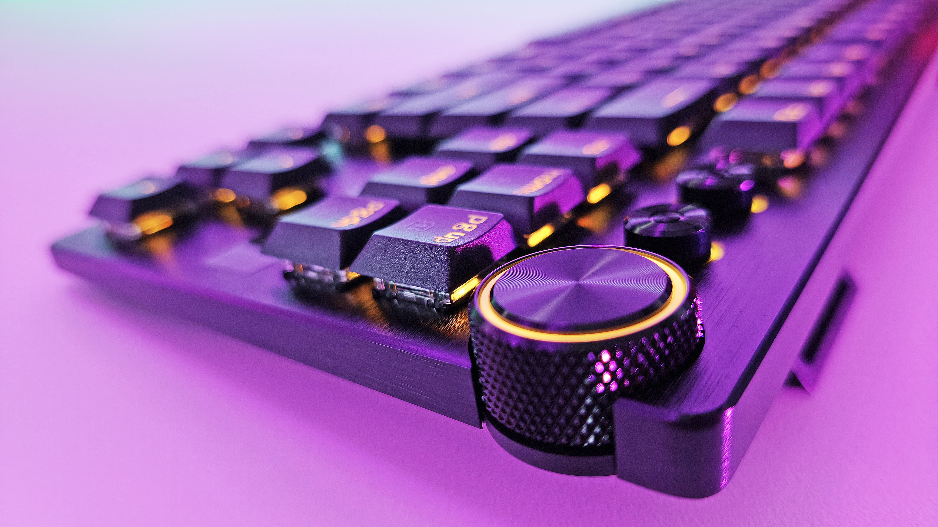 Close-up of the textured volume knob and media controls on the Razer Huntsman V3 Pro Low-Profile Tenkeyless gaming keyboard.