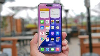 iPhone 16 Pro shown held in hand