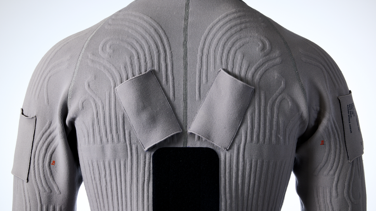 The back of a liquid cooling garment for a spacesuit with embedded tubes and air hoses built by Axiom Space.