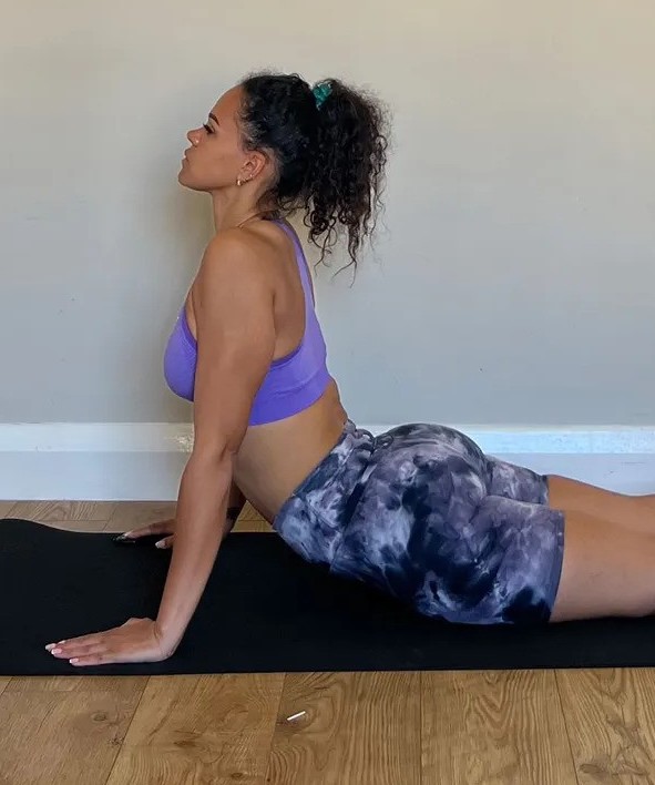 Personal trainer Jade Hansle demonstrating a cobra yoga pose 