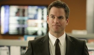 NCIS Tony standing in the office with his trademark smirk