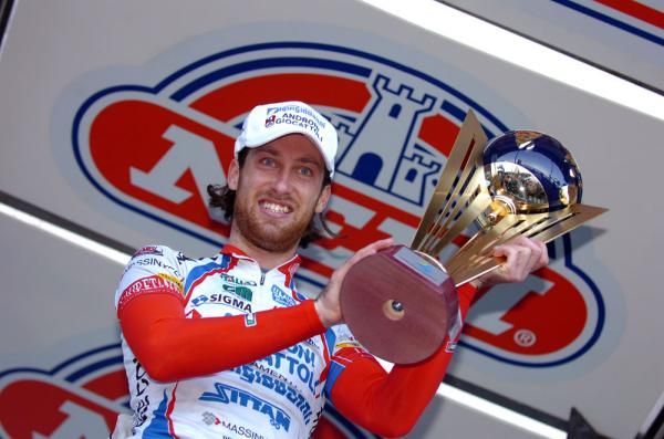 Francesco Ginanni hoists his trophy aloft