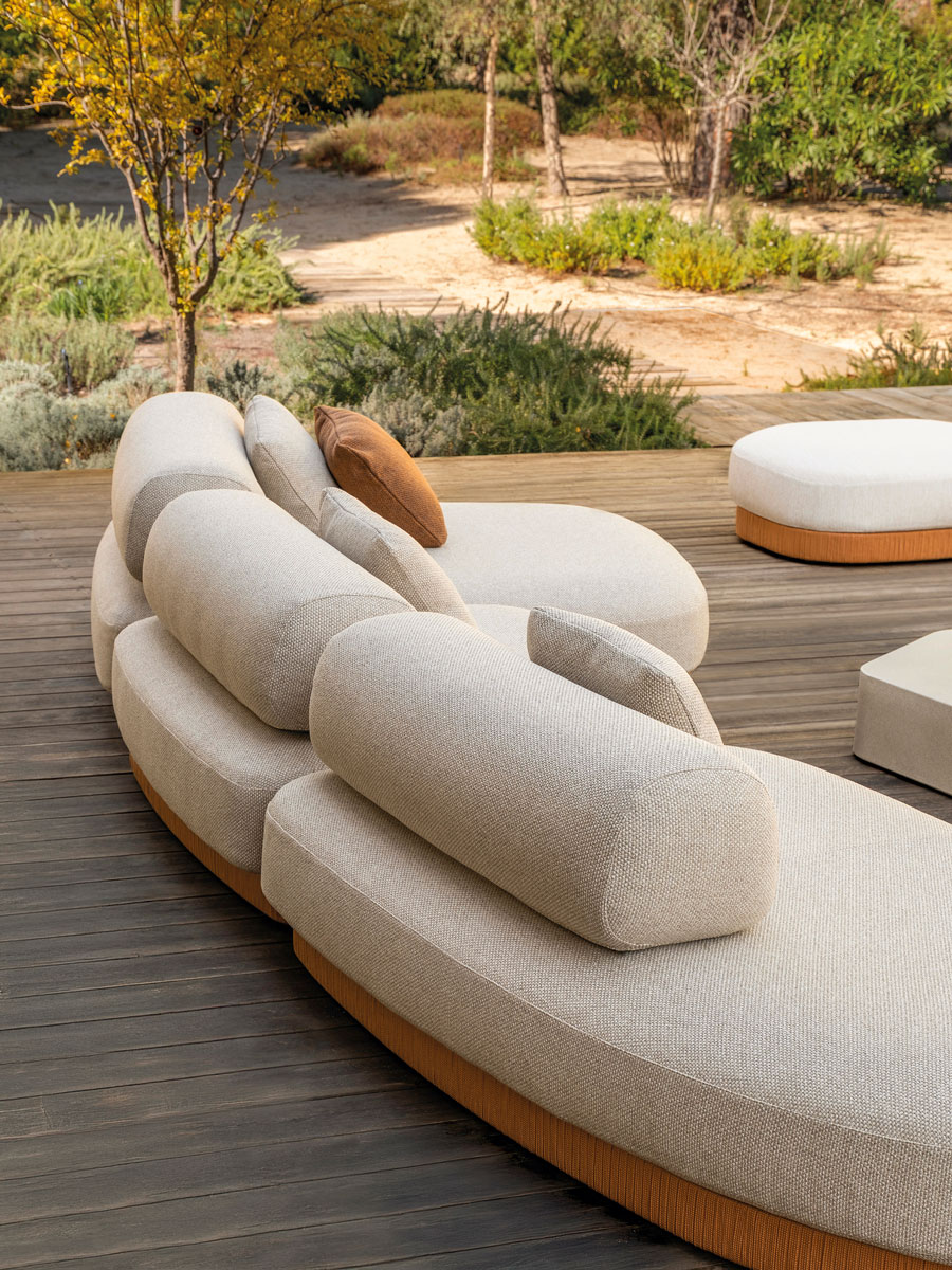 Curved outdoor sofa wth cushions