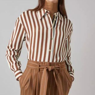 Flay lay image of woman wearing striped shirt 