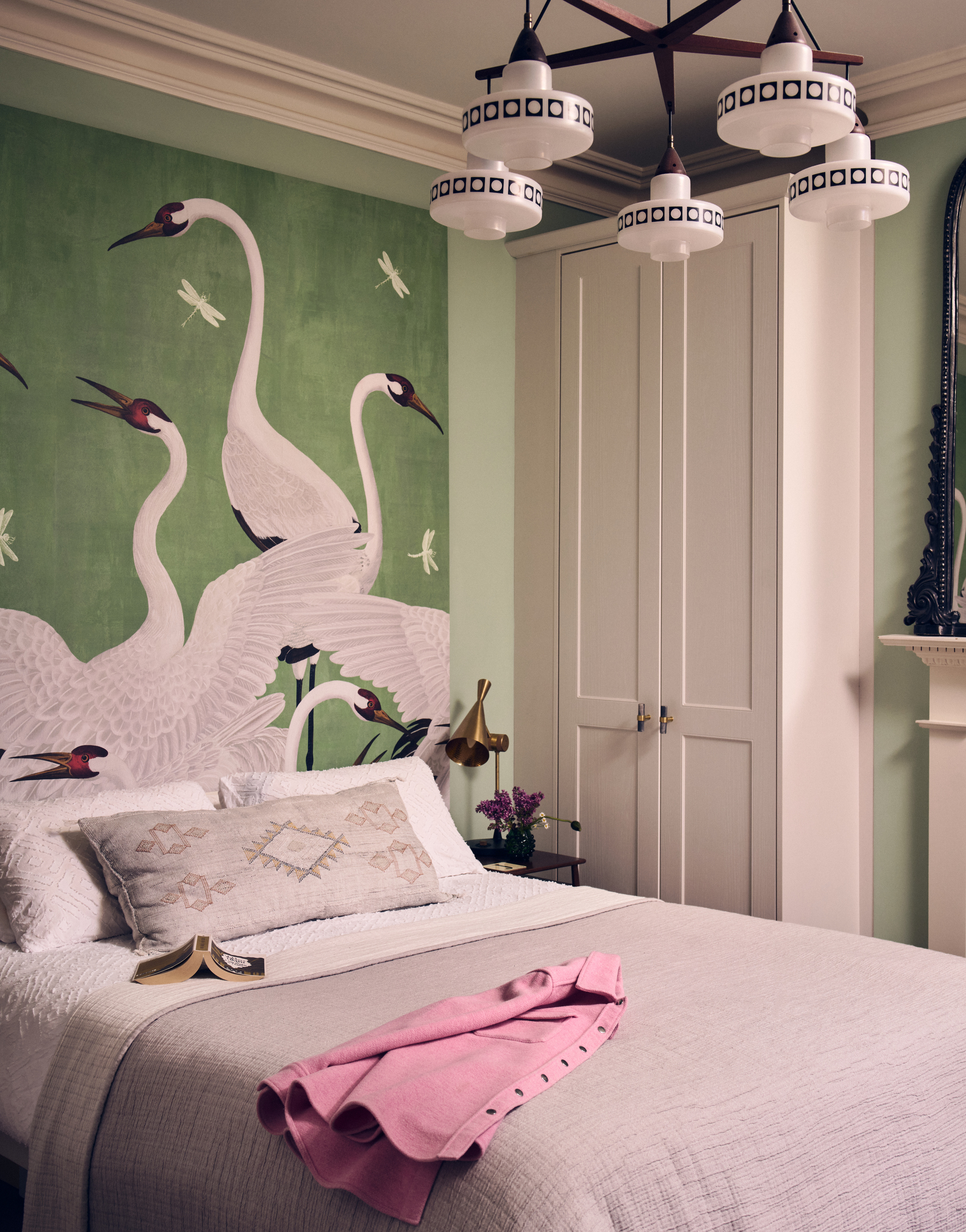 Studio Braw designed London bedroom with built-in storage and heron mural