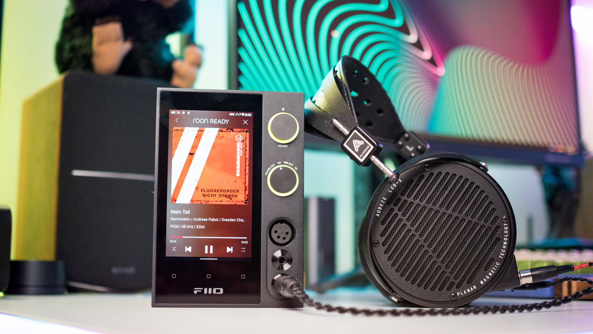 Audeze LCD-X connected to Fiio R7 with Rammstein's album on the screen
