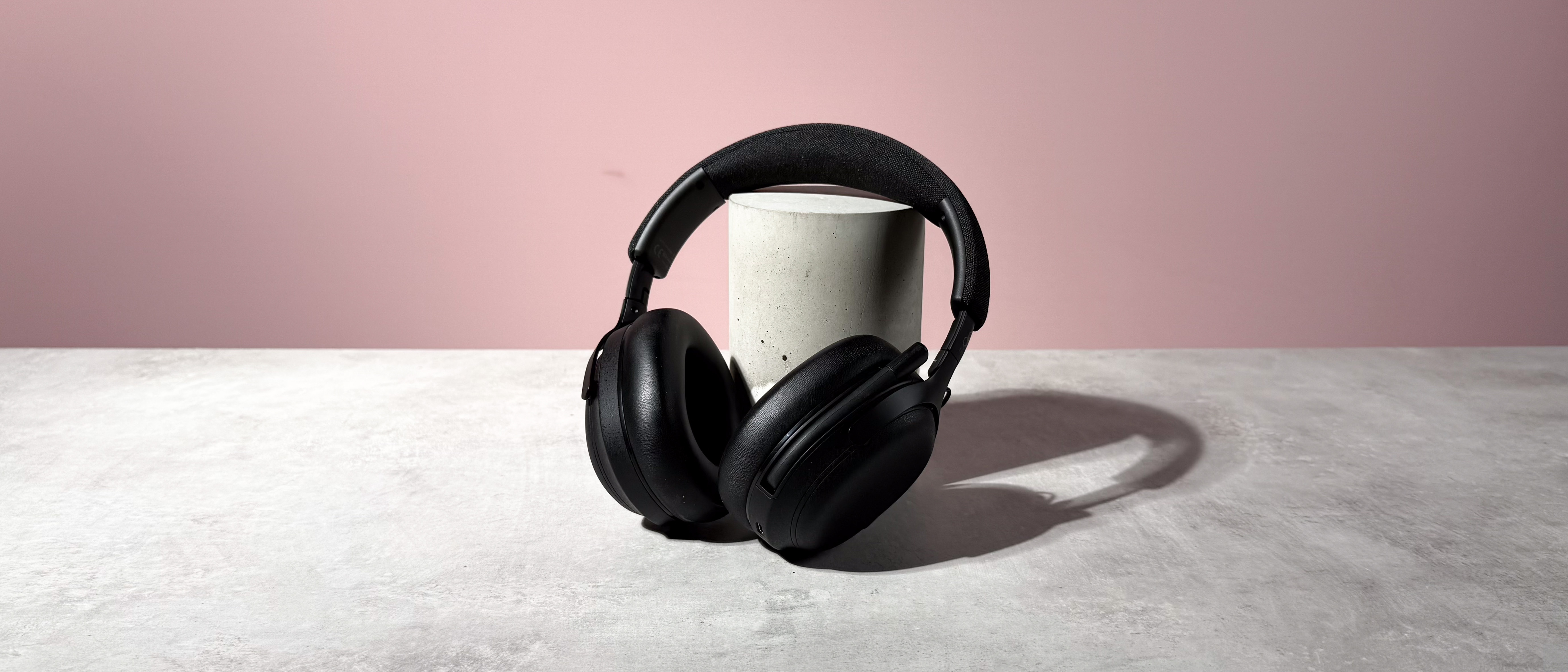 The Final VR3000 EX for Gaming unfolded and leant against a stone and concrete cylinder.