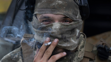 An Azov regiment soldier smokes a cigarette