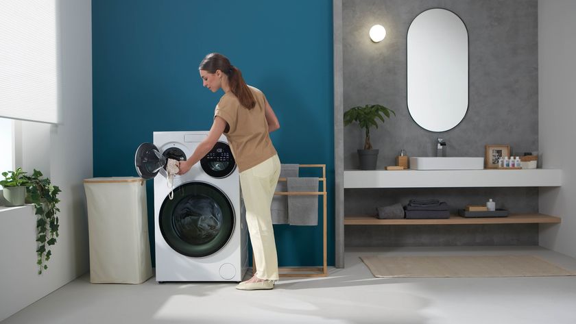 A woman using the Hoover Multi-Wash