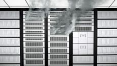 Data center server racks with smoke billowing from damaged servers.