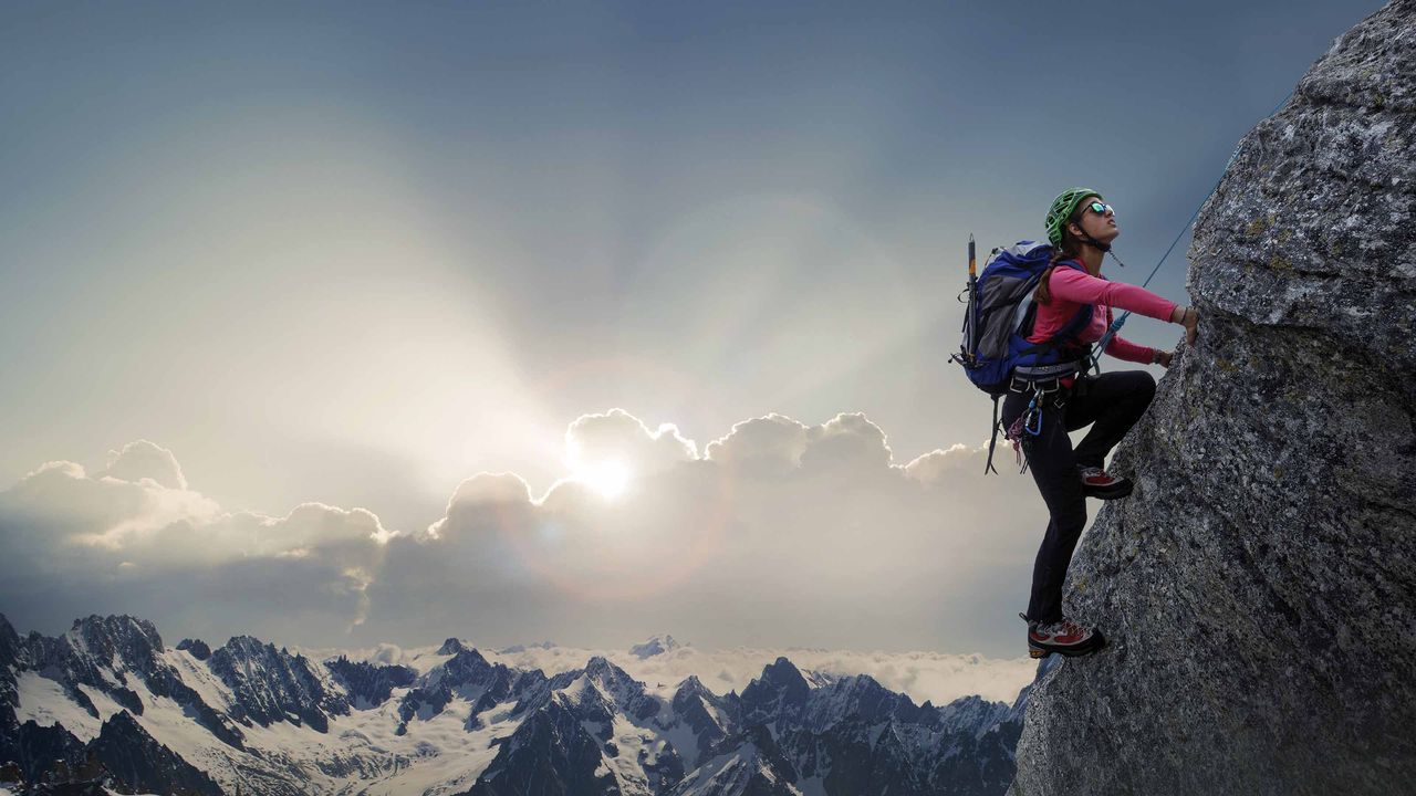 A person climbing a mountain