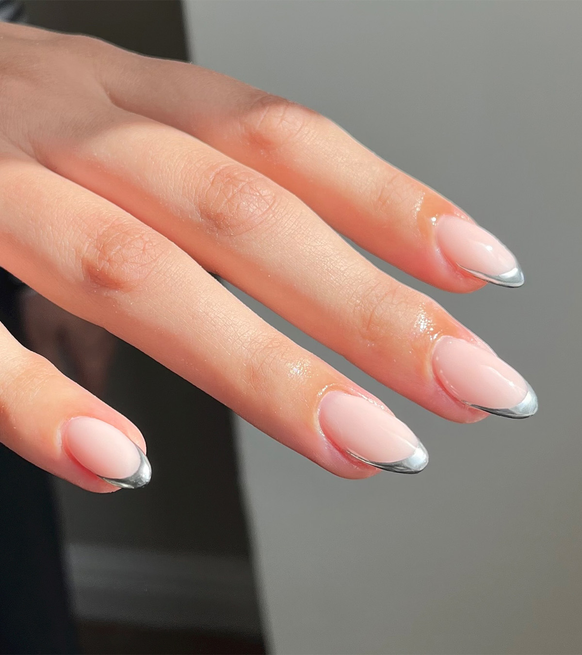 A manicure with chrome tips by Jessica White.