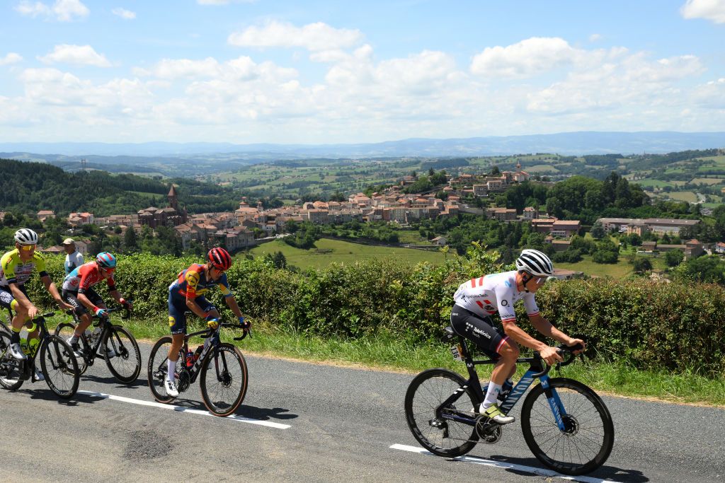 BELLEVILLEENBEAUJOLAIS FRANCE JULY 13 LR Mike Teunissen of The Netherlands and Team IntermarchCircusWanty Maxim Van Gils of Belgium and Team Lotto Dstny Juan Pedro Lopez of Spain and Team LidlTrek and Gregor Mhlberger of Austria and Movistar Team compete climbing to the Cte de ThizylesBourgs 633m during the stage twelve of the 110th Tour de France 2023 a 1688km stage from Roanne to Belleville en Beaujolais UCIWT on July 13 2023 in Belleville en Beaujolais France Photo by David RamosGetty Images