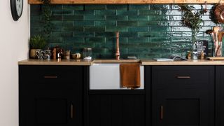dark green kitchen wall tiles with belfast sink