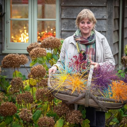 Garden expert Sarah Raven in an autumnal garden