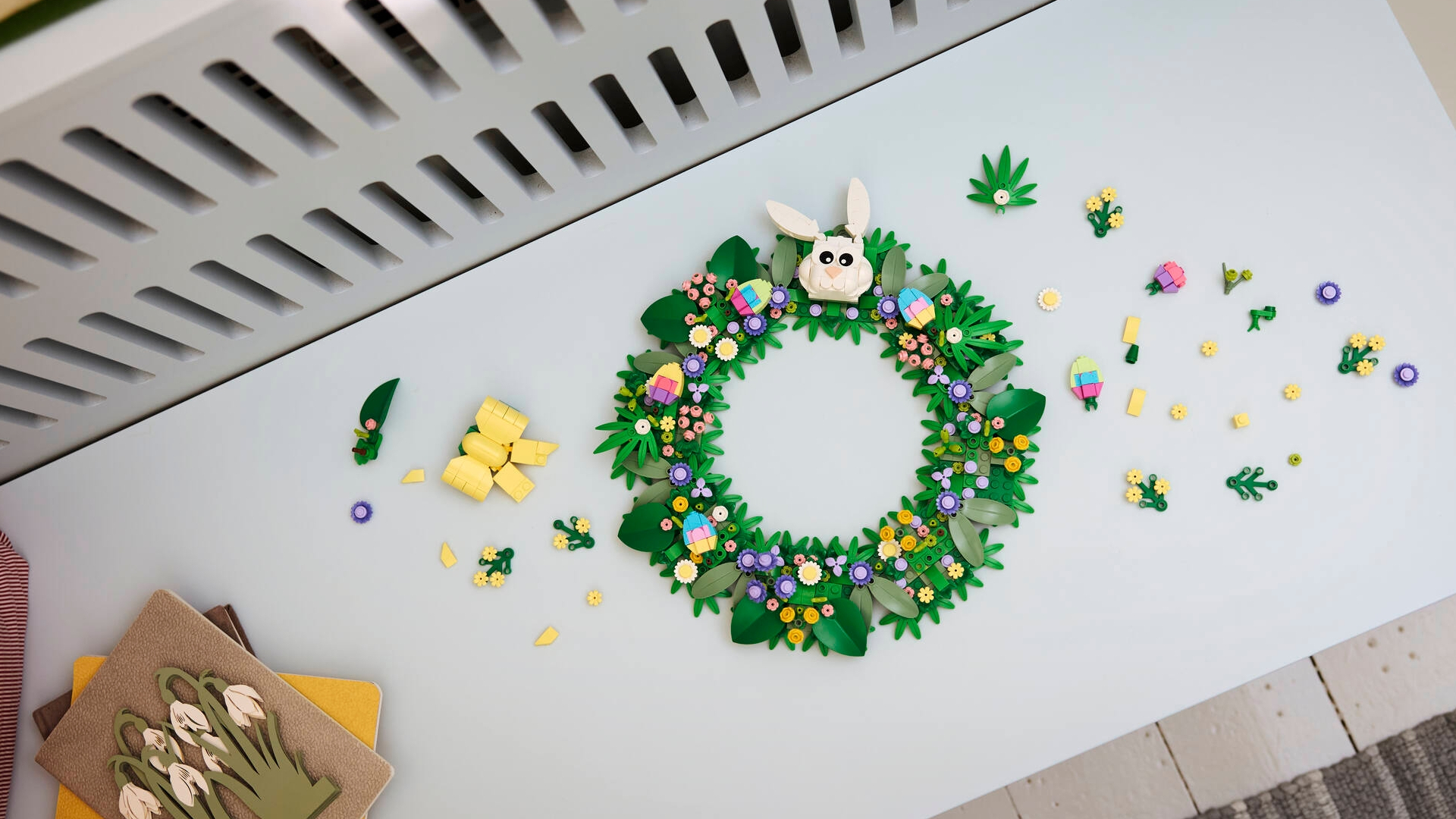 Lego Spring Wreath lying partially assembled on a bench