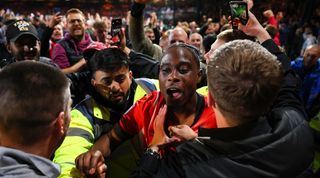 Luton's Pelly Ruddock Mpanzu c elebrates with fans after his side's Championship semi-final play-off win over Sunderland in May 2023.