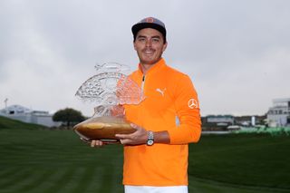 Rickie Fowler holding the Waste Management Phoenix Open trophy