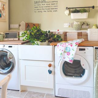 A laundry room with a washing machine and a dryer