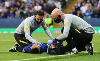 Hakim Ziyech lies on the pitch injured