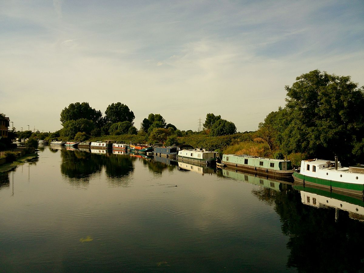 Sample image taken with Camp Snap 2 digital compact camera, showing houseboats moored on river in bright sunlight