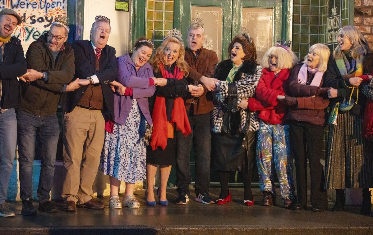 The locals band together outside the Rovers Return