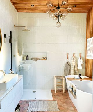 Bathroom with cream tiles and wall panels