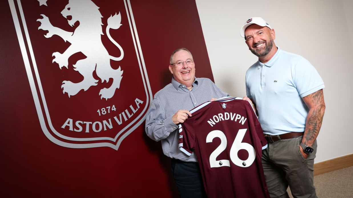 Aston Villa's representives holding a team's shirt named as NordVPN