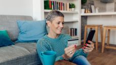 Woman making an online payment from home 