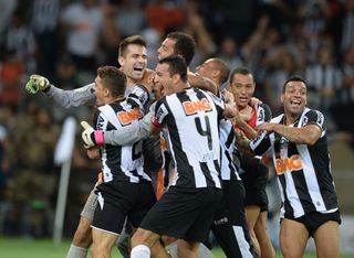 Atletico Mineiro celebrate after beating Olimpia on penalties to win the Copa Libertadores in July 2013.