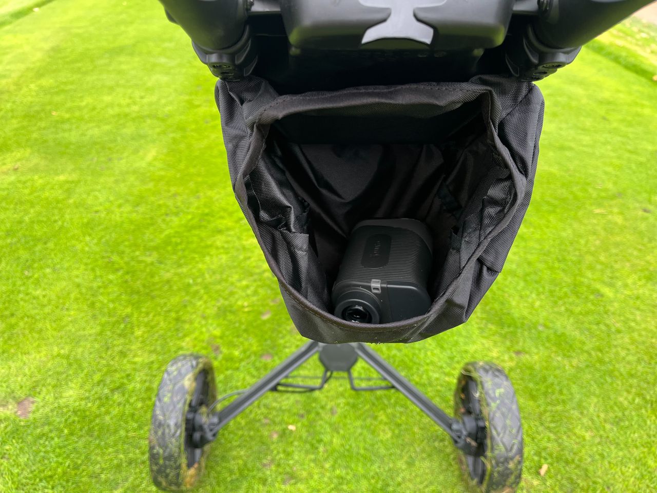 The storage pouch on the BagBoy slimfold push cart