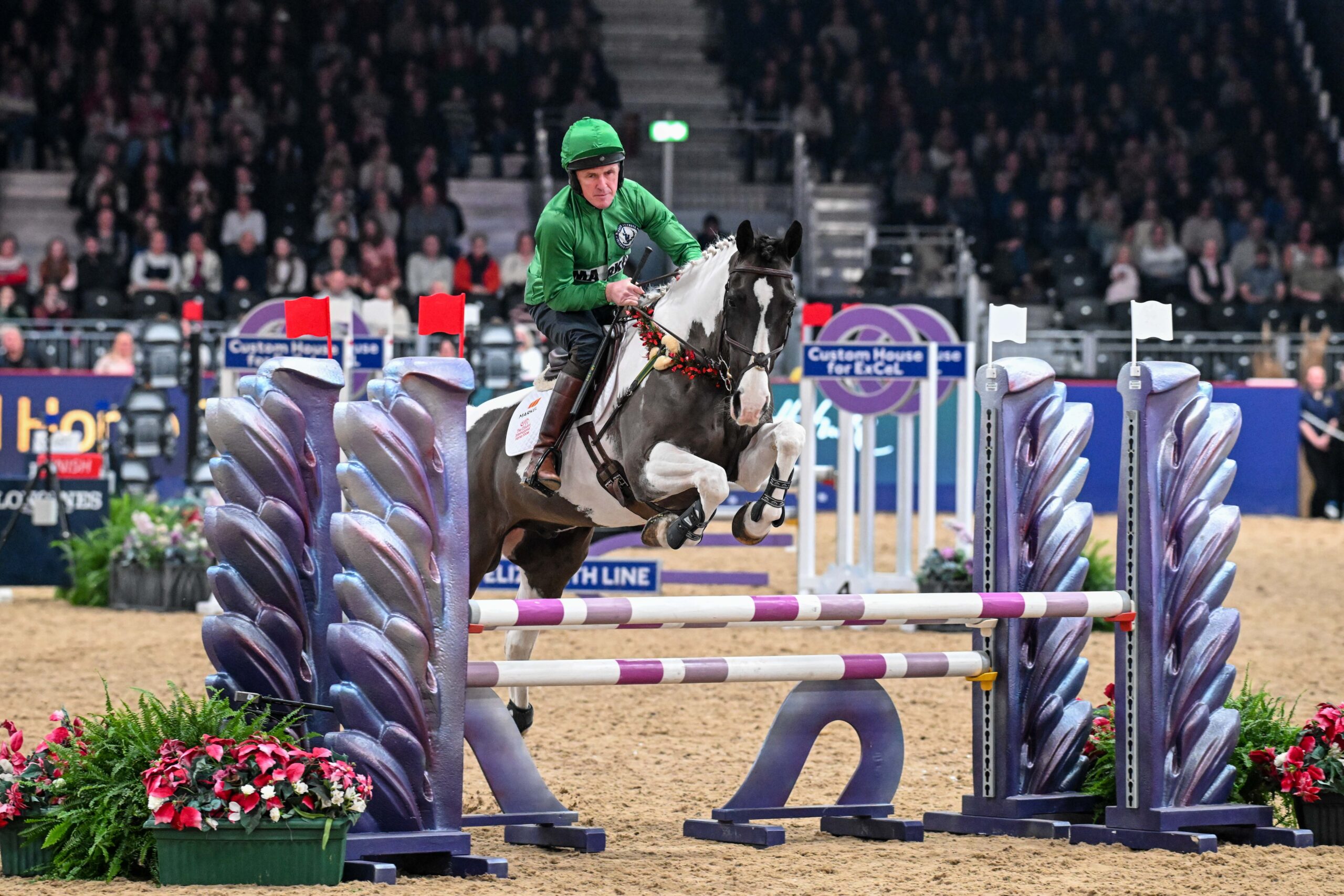 AP McCoy jumping at the London International.